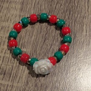 Red and Green Beaded Bracelet with White Rose